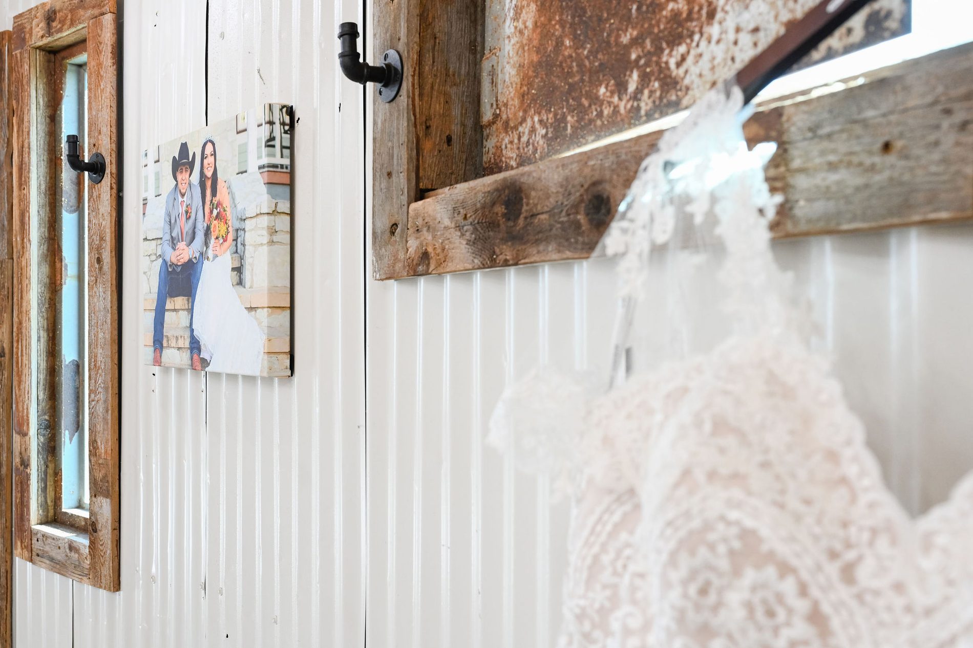 The dress hanging on the barn door