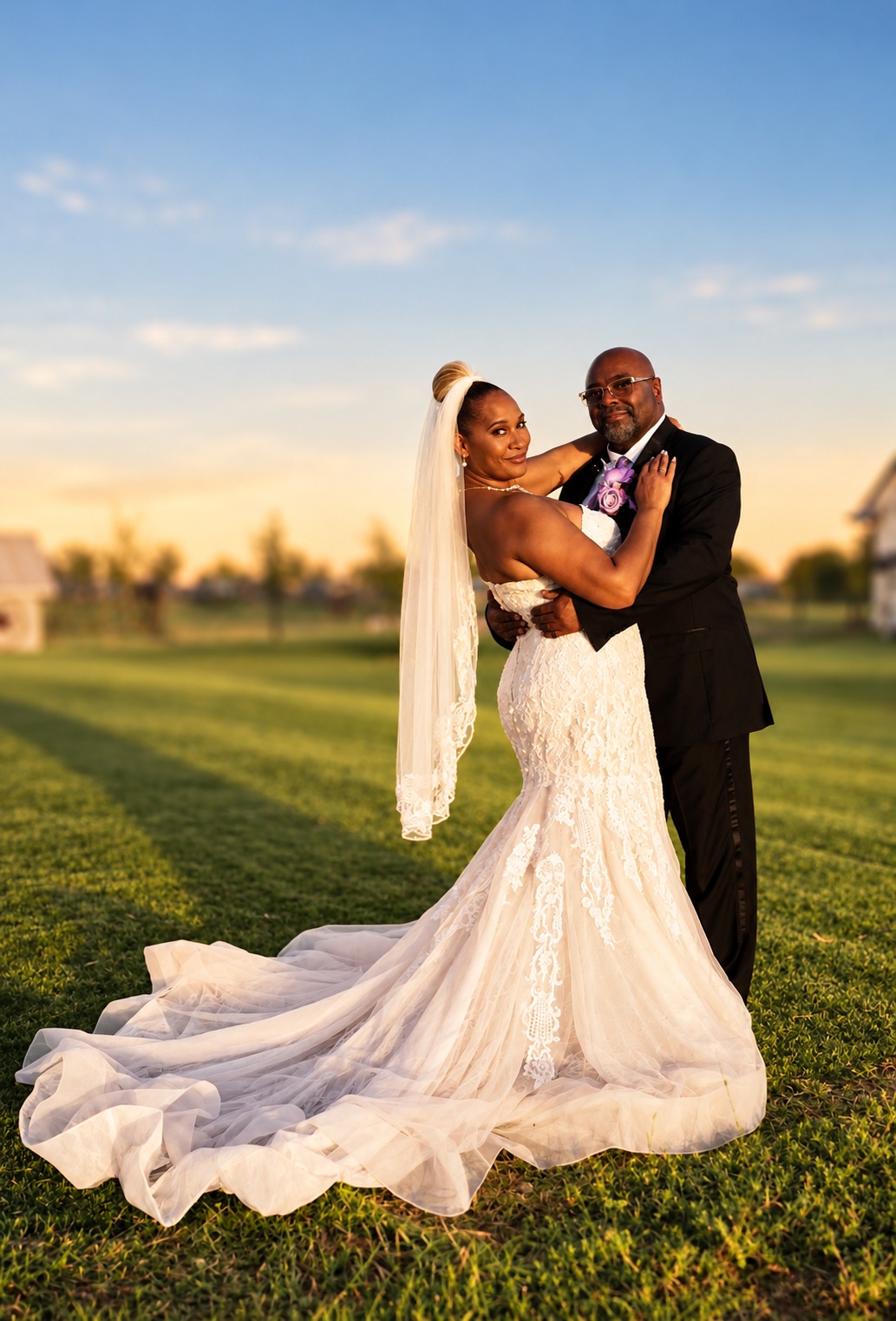 Newlyweds at golden hour on the lawn at Moonshadow Ranch